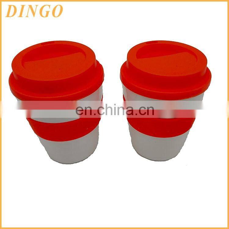 Best selling promotional gift plastic coffee mug with lid and coated with silicone jacket customized logo printing