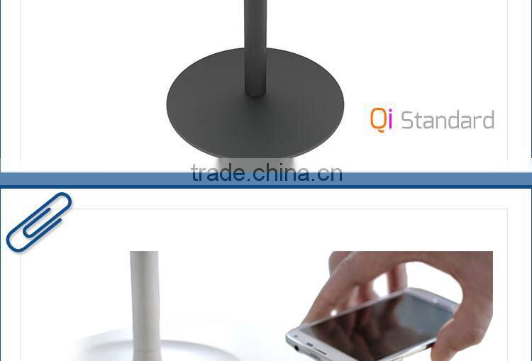 New smartphone Qi desktop wireless charger embedded on the furniture table