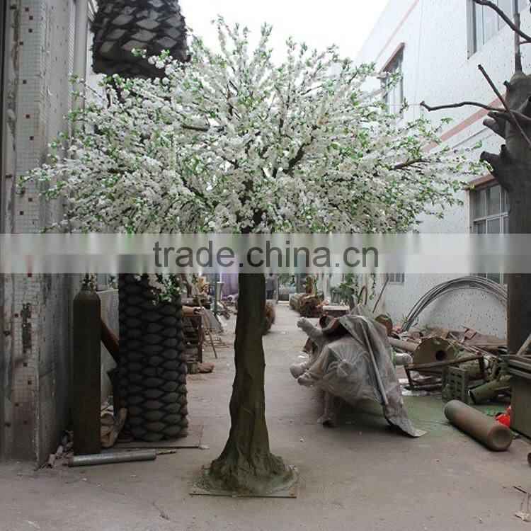 Pink artificial cherry blossom trees with rotating base