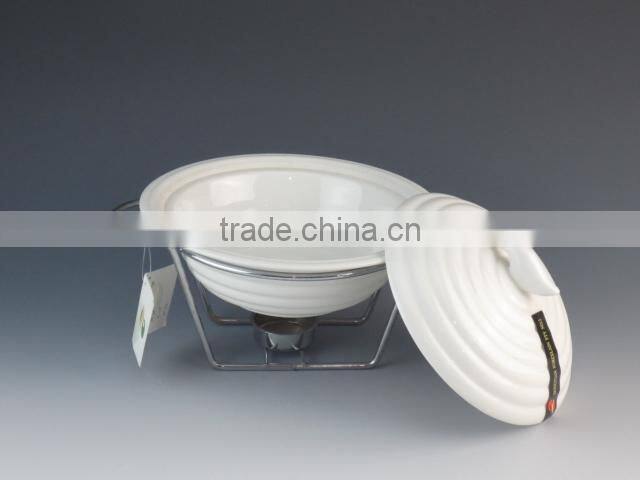 white porcelain casserole with iron rack