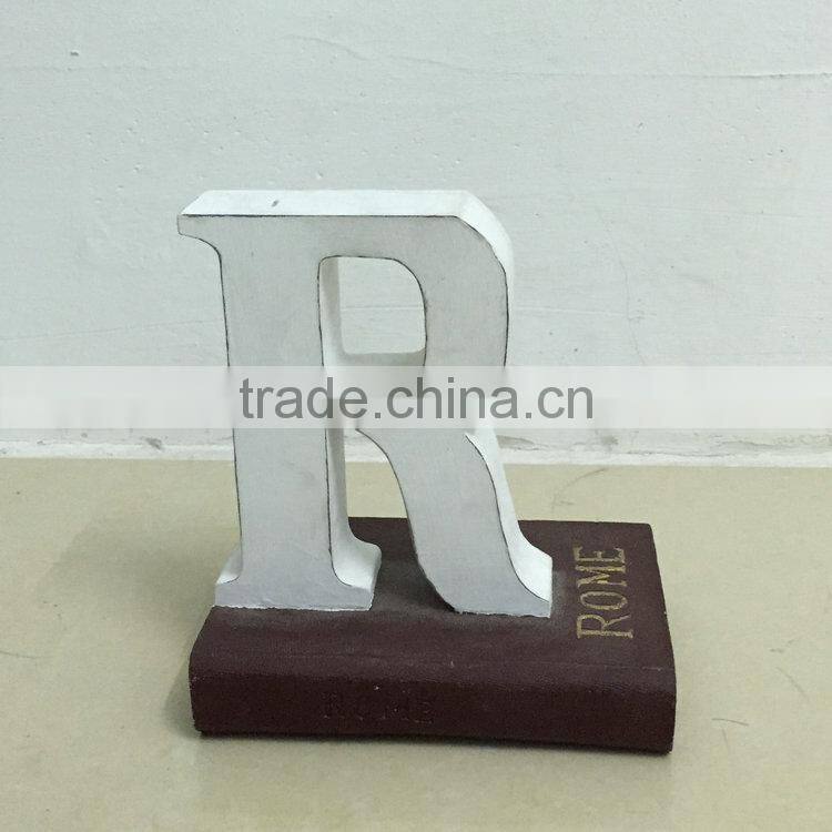 Polyresin book with letter statue
