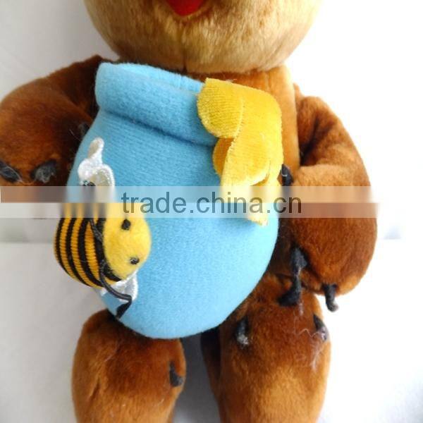 Eating honey plush bear toys holding honey pot
