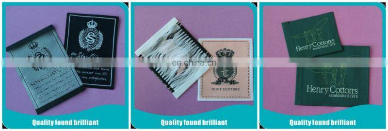 Heat transfer woven label for children's garment and toy