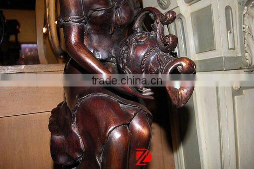 Bronze lady statue with shell water fountain