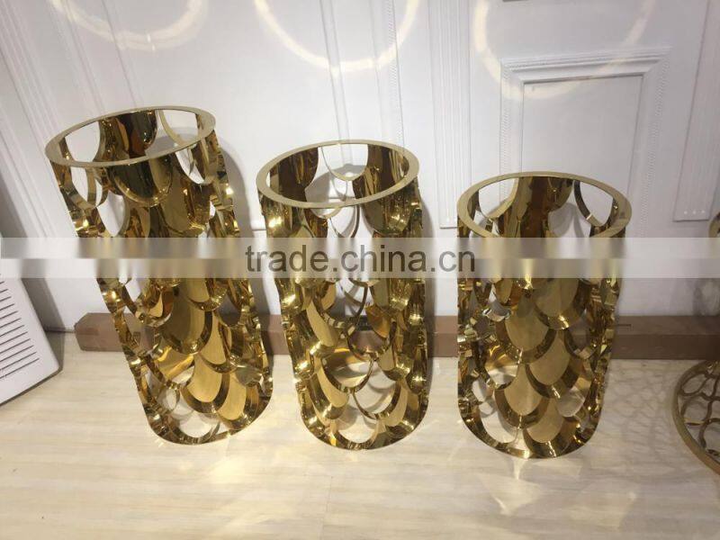 Golden color metal flower stand pergola with marble top