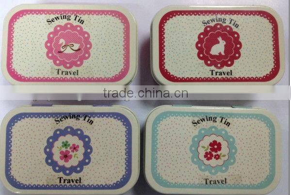 retro sewing kit in tin
