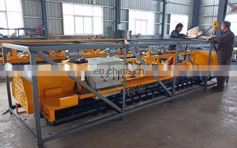 concrete road paver machine showing the first auger blade roller laying machine