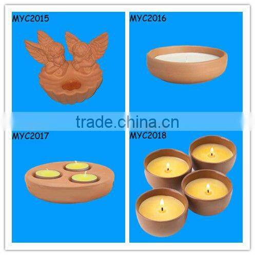 Home decoration candles in clay pots