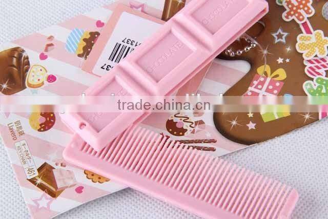 Chocolate shaped hair brush with hanging chain/folding comb