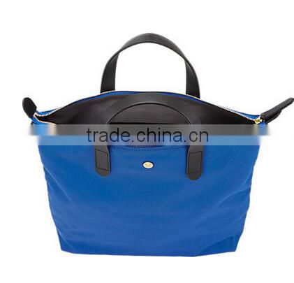blue fabric small tote shopper bag with black smooth leather trim