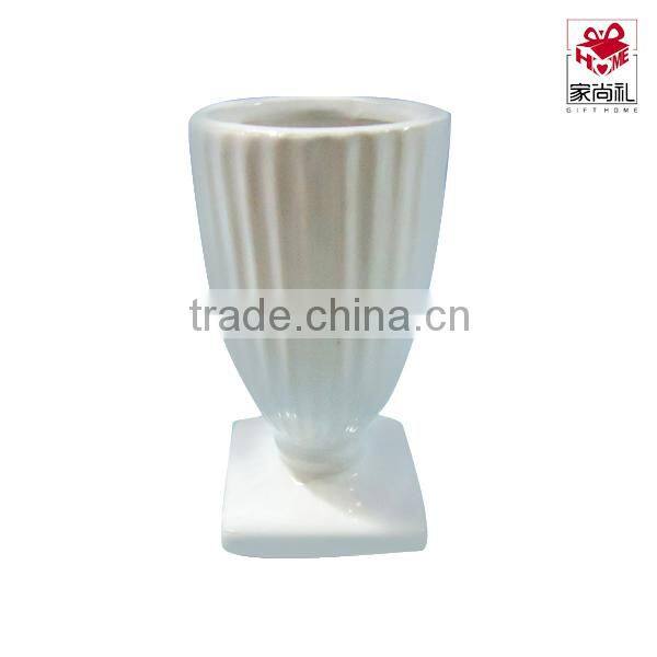 white ceramic planter and mini square vase