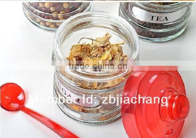 glass spice box with plastic cap and spoon