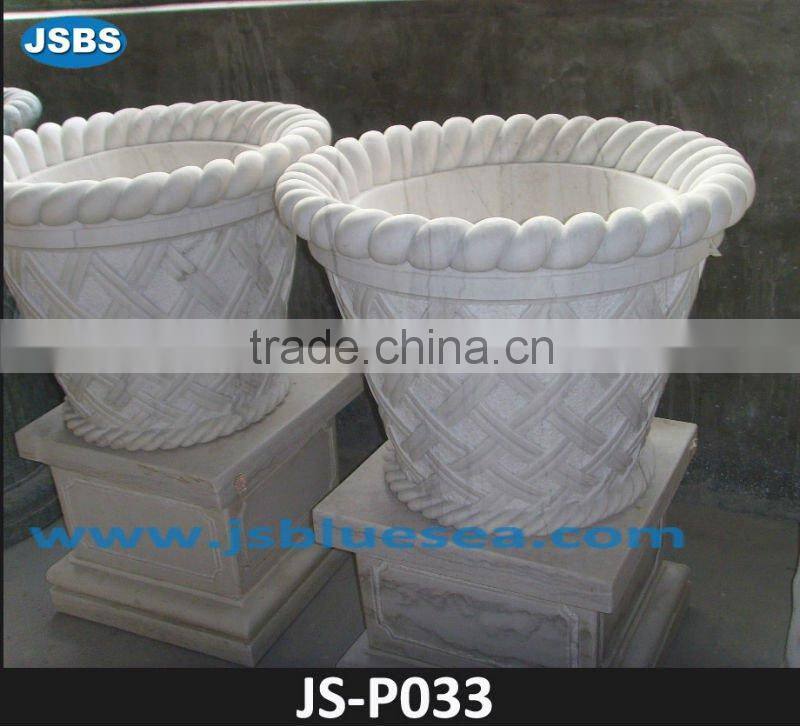 Yellow flowerpot with grape carving design