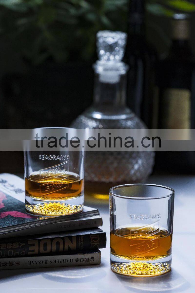 300ml clear glass cup with small bubbles at the bottom and embossed letter for drinking