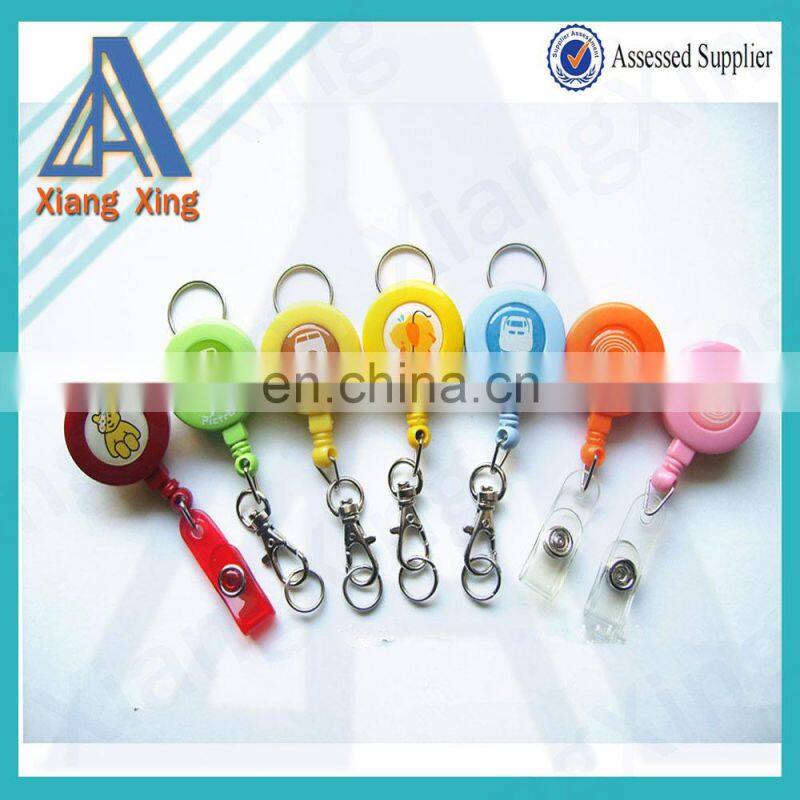 Round plastic logo attached badge with retractable string reels