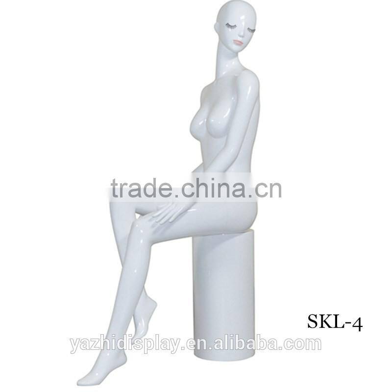 Abstract sexy headless female sitting mannequin for window display