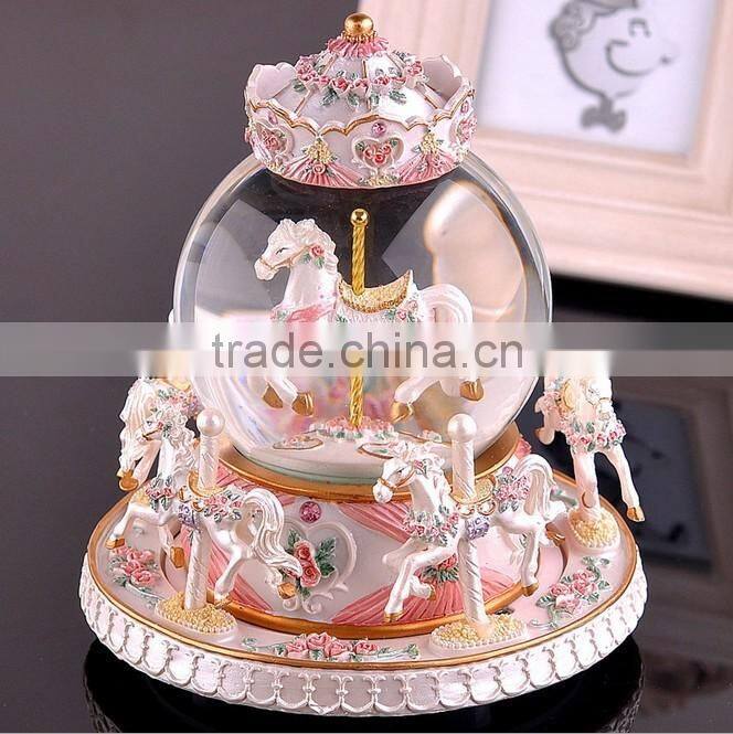 Exclusive resin carrousel rotate LED music snow globe