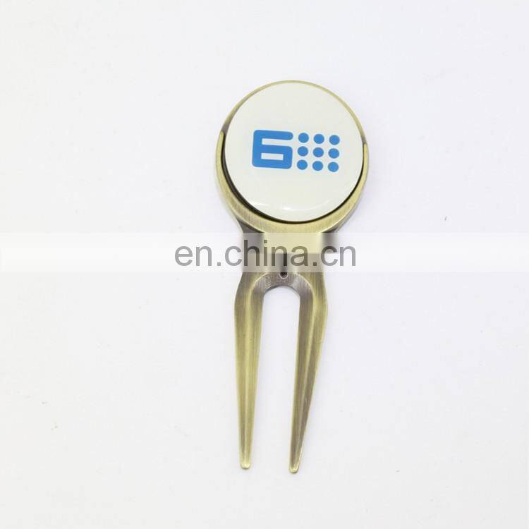 metal golf divot repair tool with golf ball marker