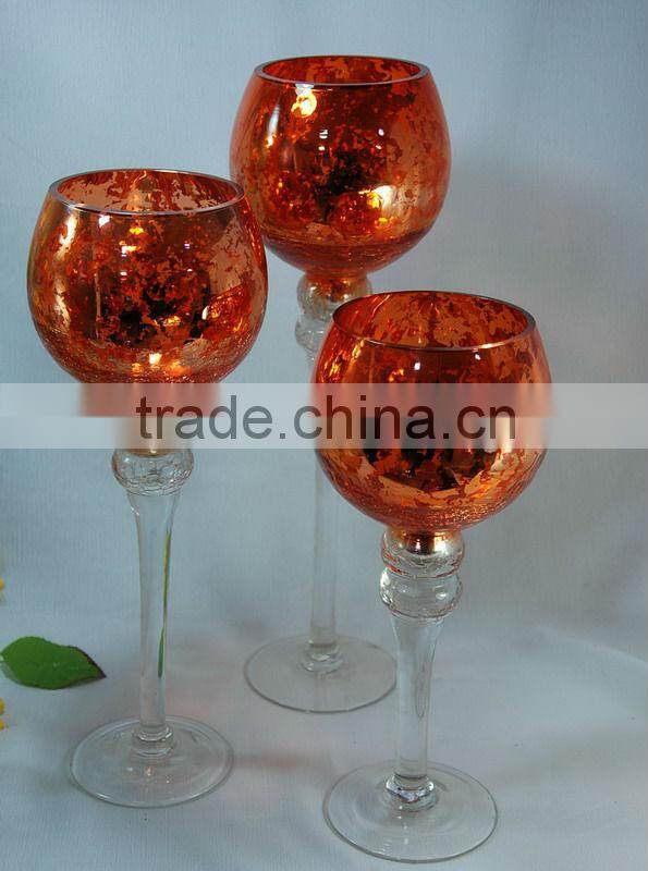 green colored goblet glass candle holder