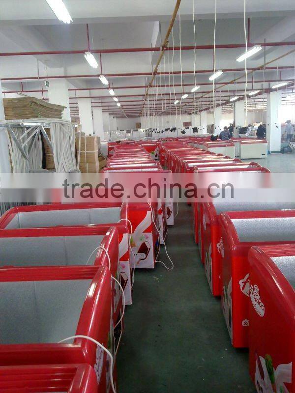 Curved glass door freezer with light box