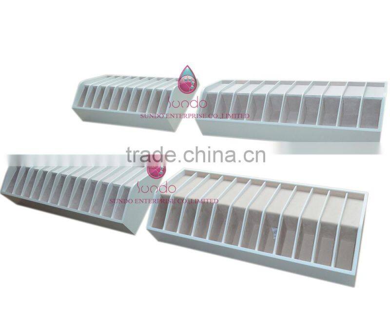 custom white lacquered wood belt display