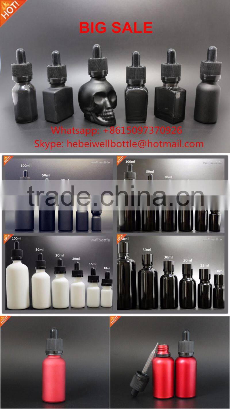1oz 2oz clear glass skull e-liquid bottle with child proof dropper/hot sale skull glass e-liquid bottle 30ml