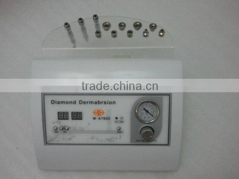 Portable diamond tip microdermabrasion machine