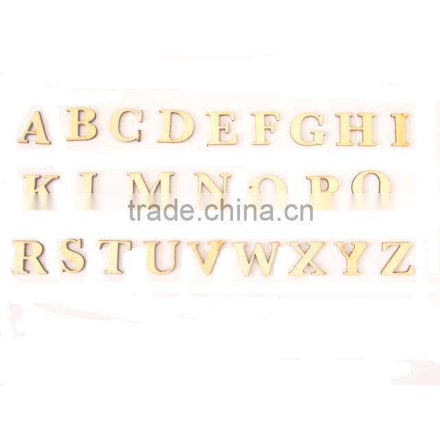 Yellow carved little table top used cutting wooden letters