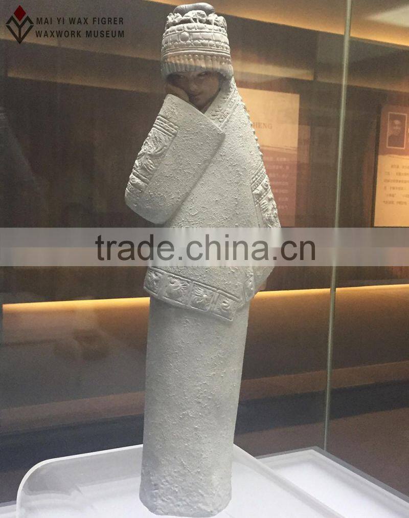 folk art sculpture of wax museum display