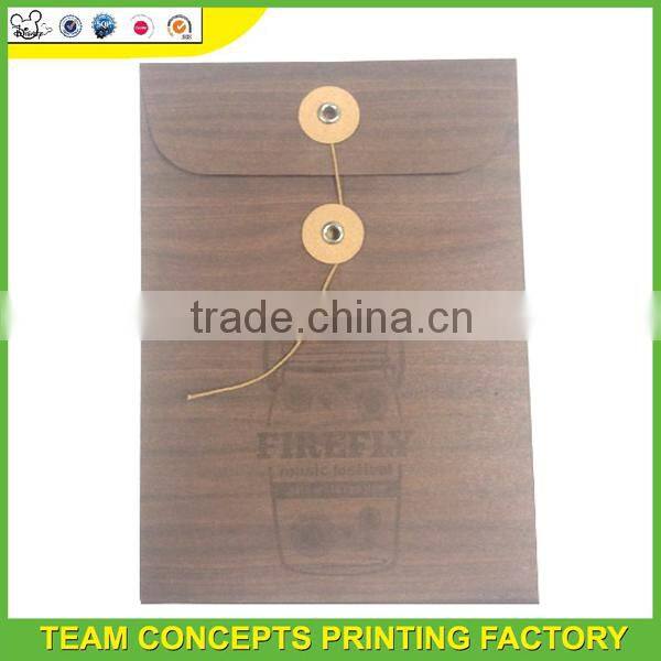 Kraft envelope with button and string closure