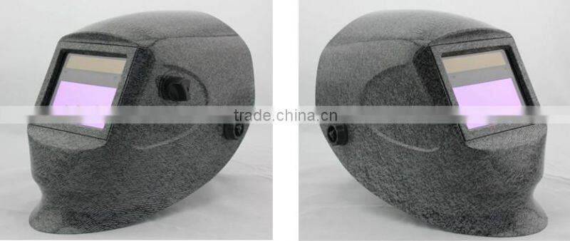 Auto-darkening welding helmet