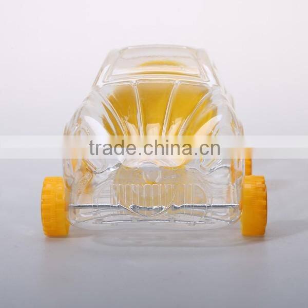 Small cute clear plastic bottles in toy shaped for candy