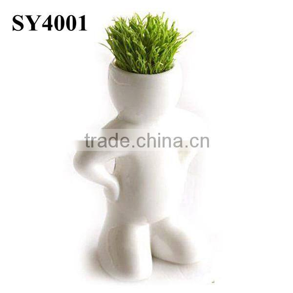Energy little white man growing grass doll