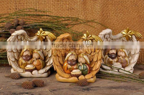 Resin nativity set in wing embrace