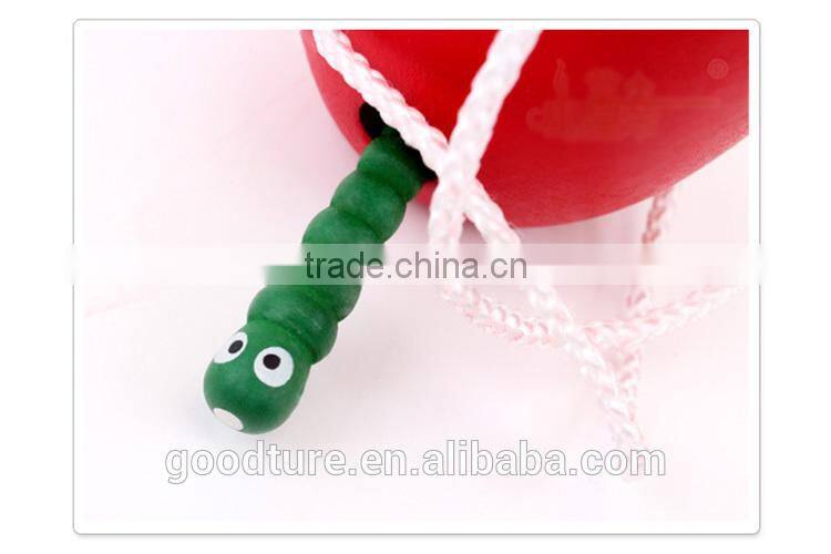 Wooden Caterpillar Eating Red Apple