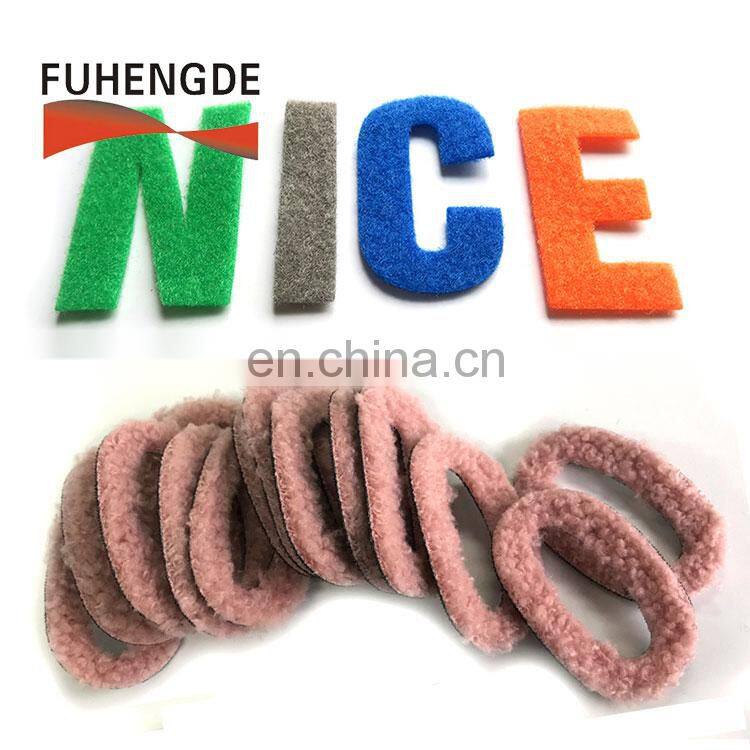 Green iron on towelling and fabric embroidery patch letters with hook loop backing fastening