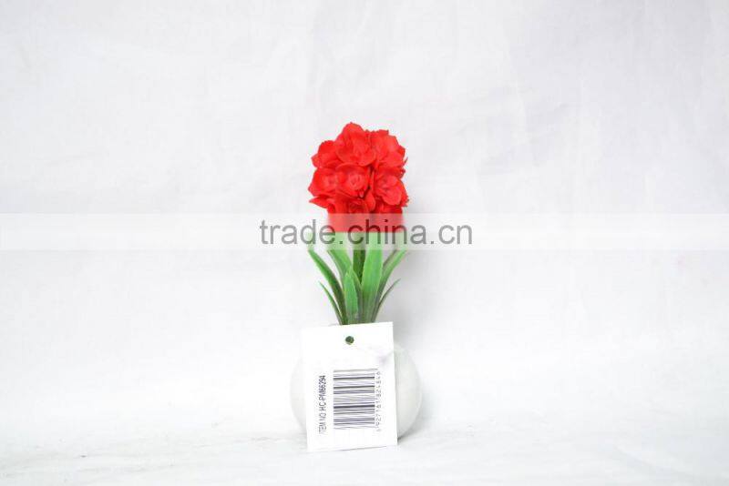 Artificial flower planted in ceramic pot for home decoration