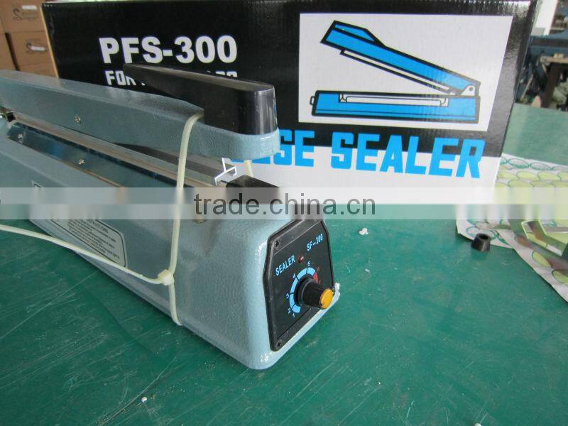 2015 new hot selling professional manual iron body hand heat press sealing machine