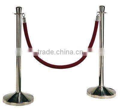 Painting black base of stanchion post for event with rope