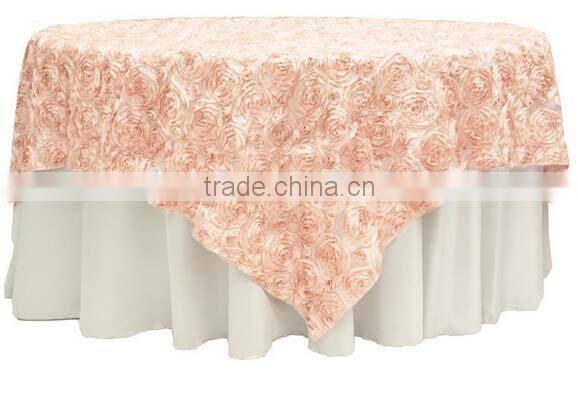 beige rossette table overlay for events