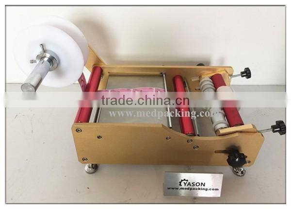 Hand Labelling Machine Pet Bottle Labeling Machine Round Jar or Cylinder Labeling