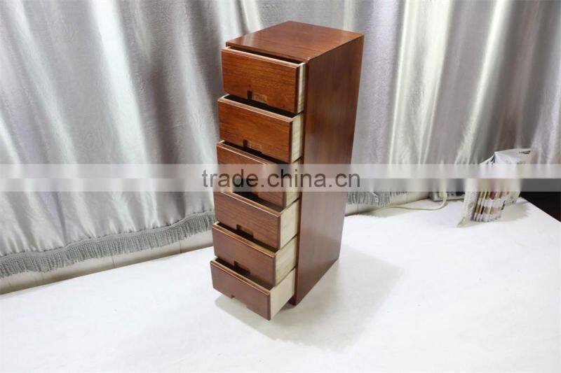 Brown color wood cabinet with many drawers