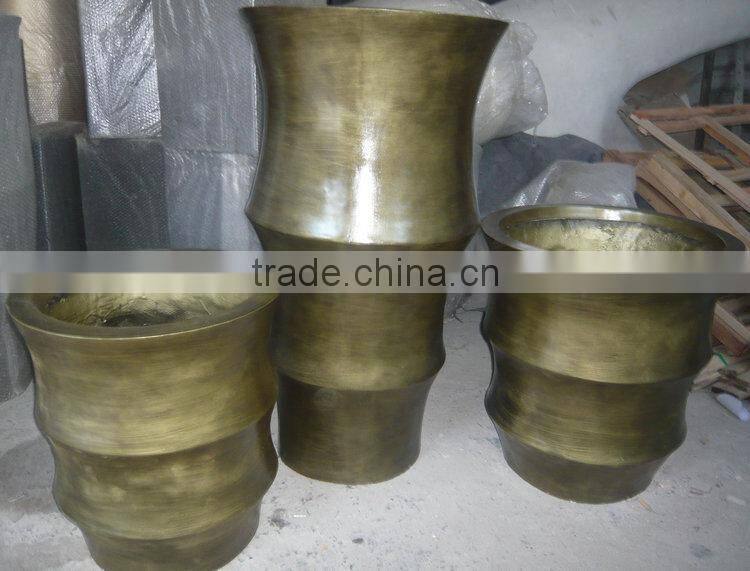 Golden fiberglass planter flowerpot