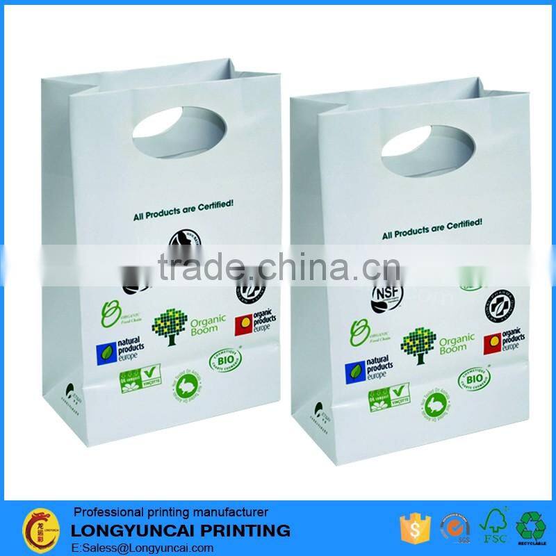 Chinese factory OEM food packaging round hole handle custom paper bag