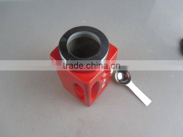 color-glazed square ceramic coffee pot with spoon