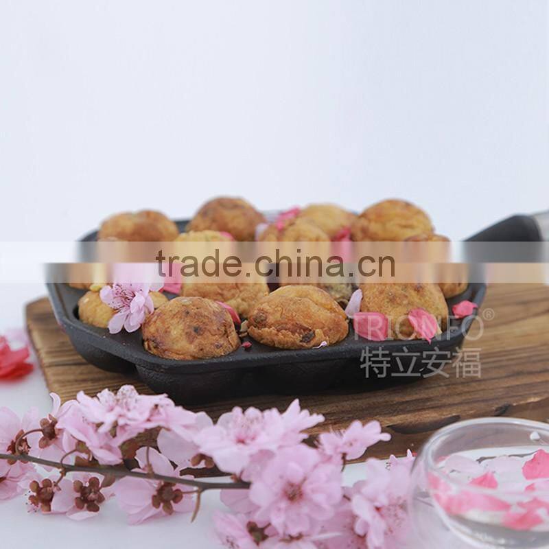 Mini cast iron takoyaki grill with wooden handle