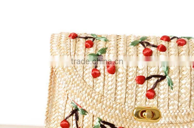 straw clutch bag with cherry pattern, gold chain cross body