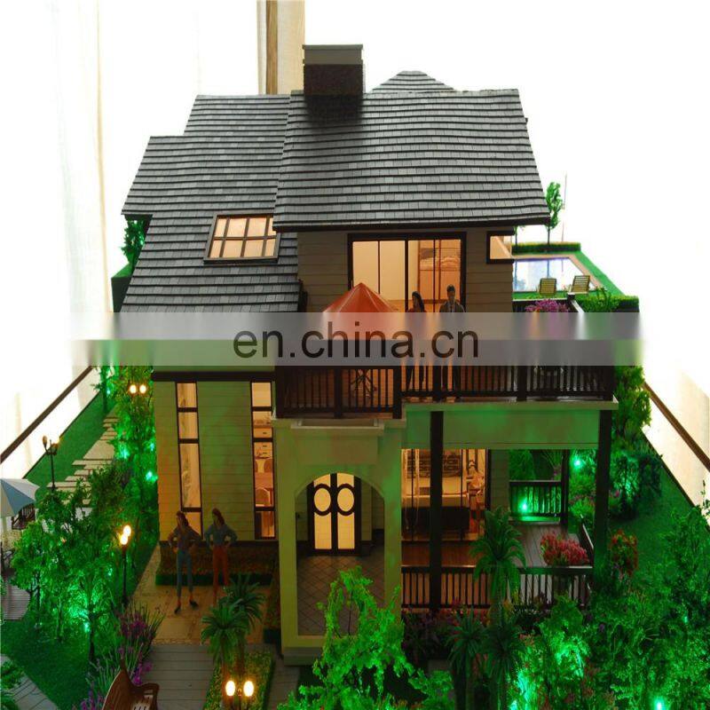 Small house model with warm light effect, architectural maquette