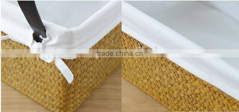 basket made of natural straw seagrass for housewaring with handle and lining