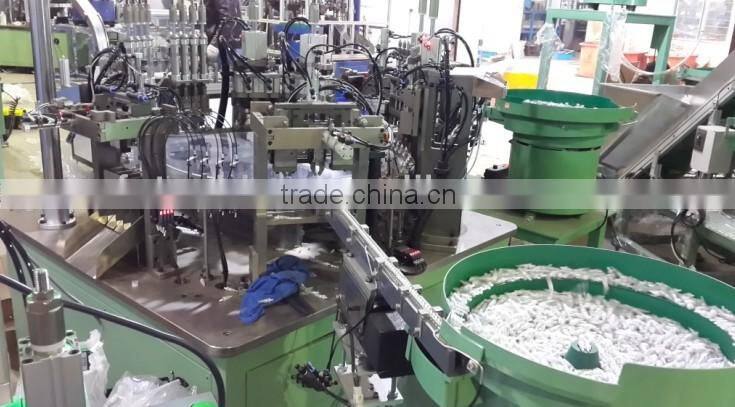 cosmetic plastic dispenser part assembly and test machine